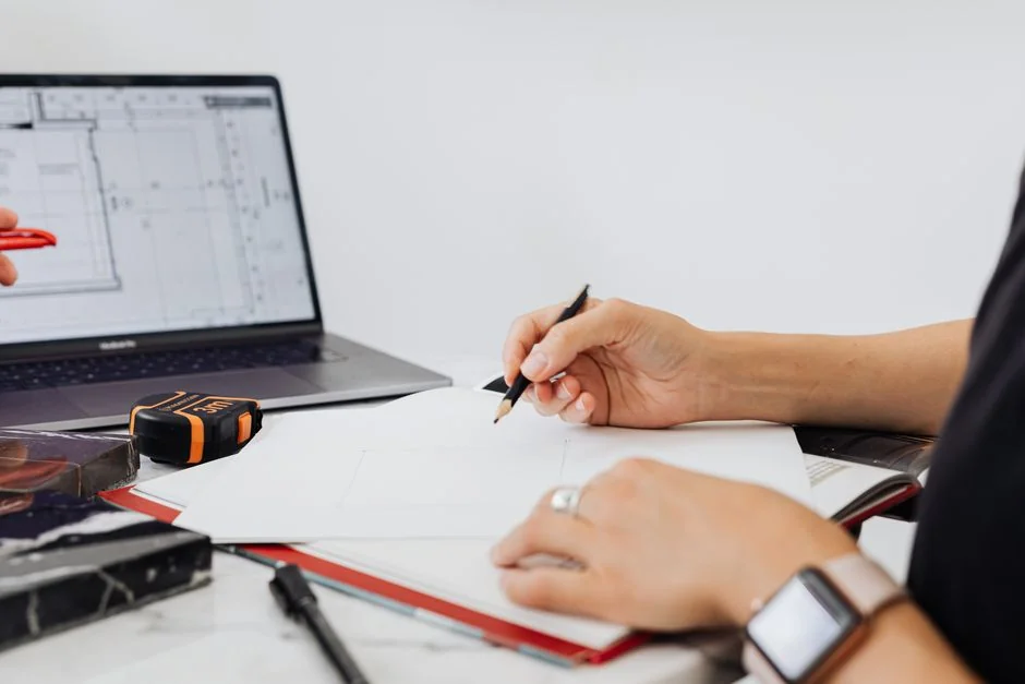 A refined office desk arrangement with Apple devices, including an iMac, MacBook, and iPad.